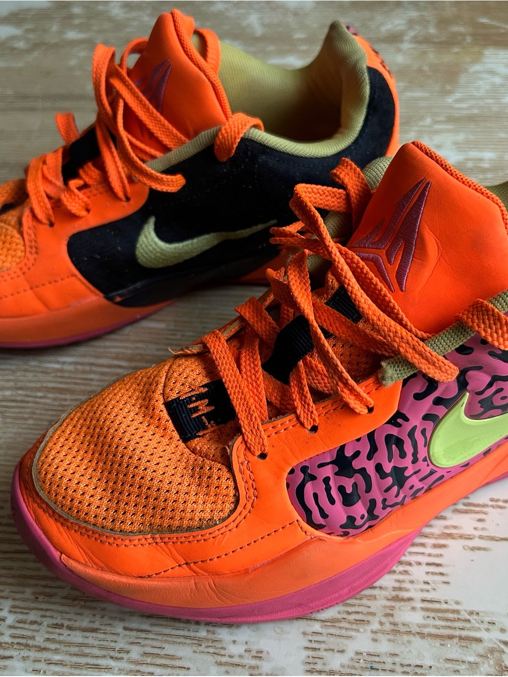 Nike Kids Low-Top Sneakers in Orange with Pink and Black Accents